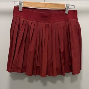 Athleta Match Point Laser Cut Chic Burgundy Pleated Tennis Skort